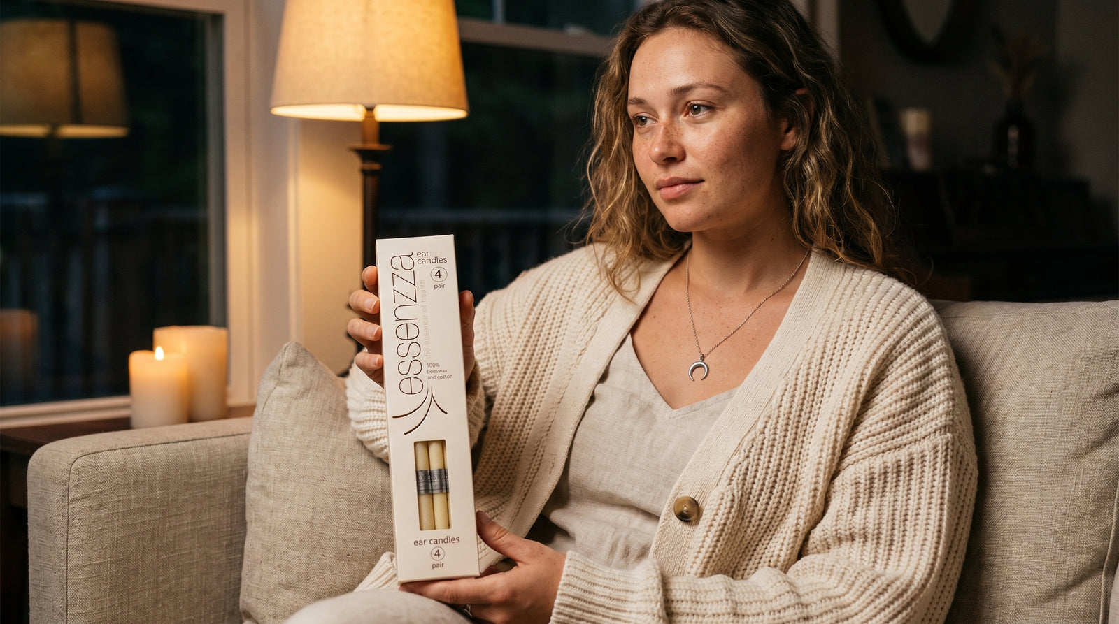 Essenzza Original ear candles held in a calm evening — a soothing screen-free wind-down ritual