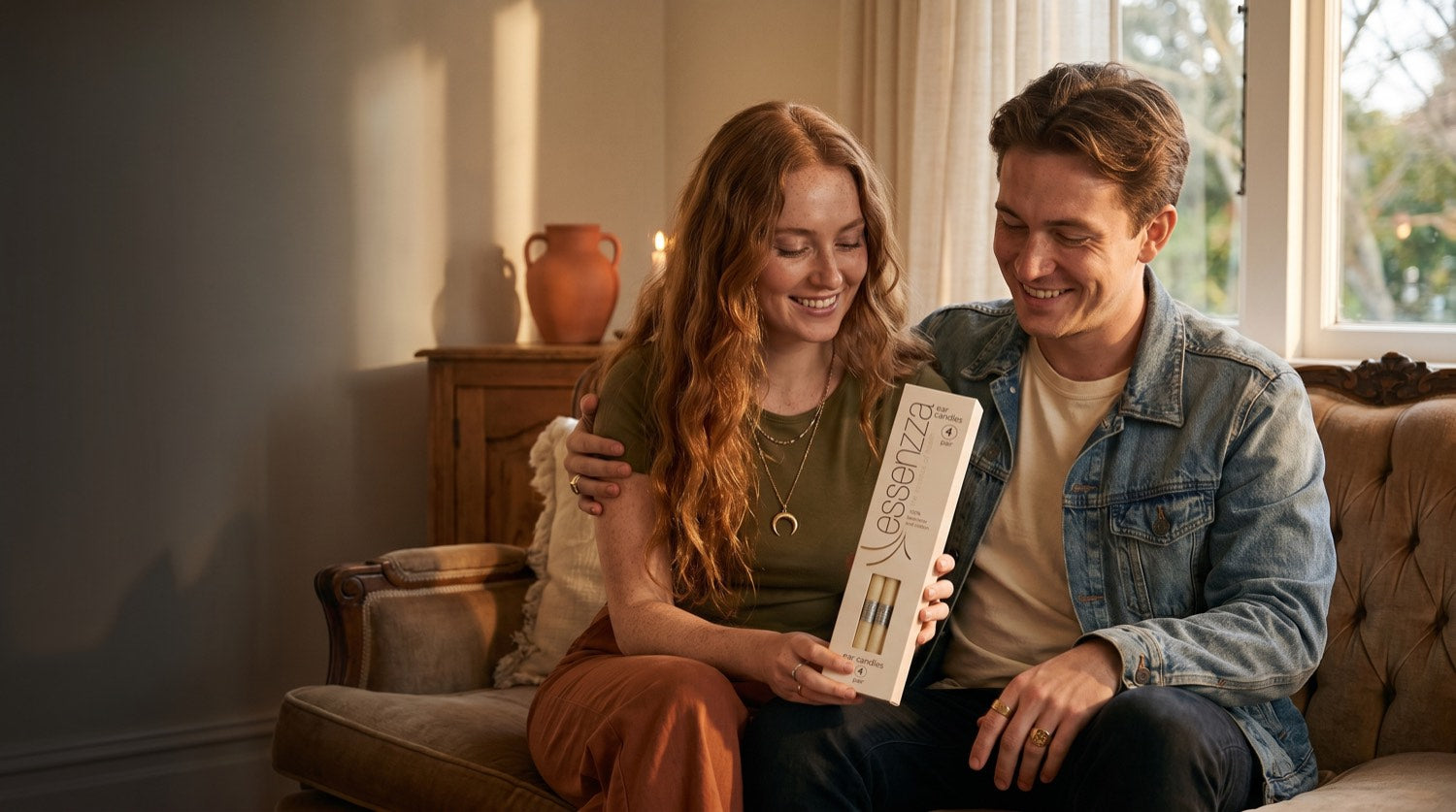 A young couple relaxing at home with a pack of Essenzza ear candles